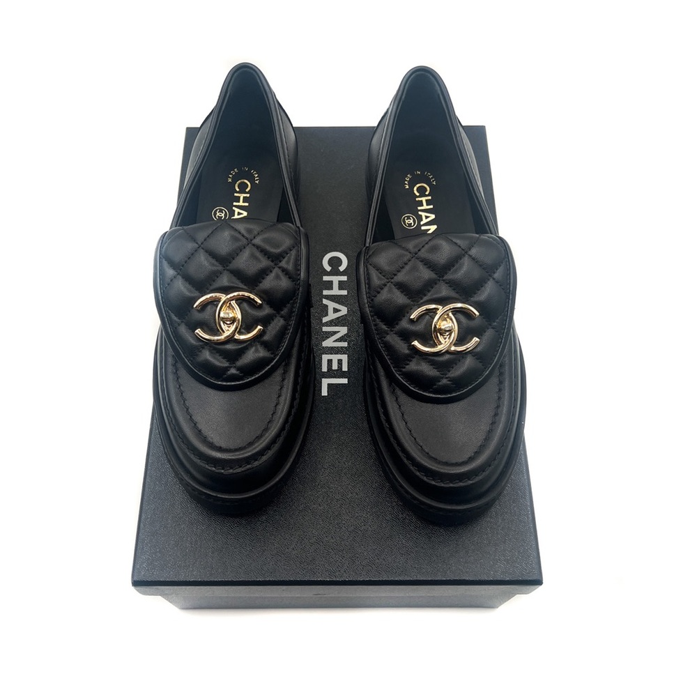 CHANEL Black and Gold Leather Flats with Iconic Logo